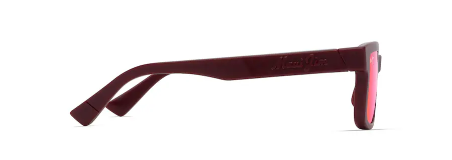 Side view of maroon sunglasses with red lenses and a brand name embossed on the temple, pairing elegance with precision like an auto draft.